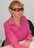 Woman wearing 7eye Churada glasses to relieve dry eyes in the office